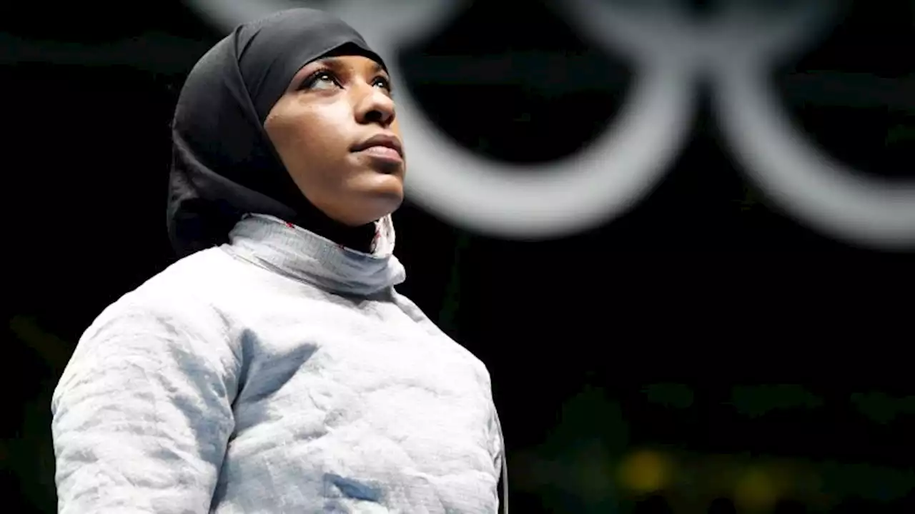 A New Jersey teacher accused of removing a student's hijab sues Olympic fencer and others | CNN