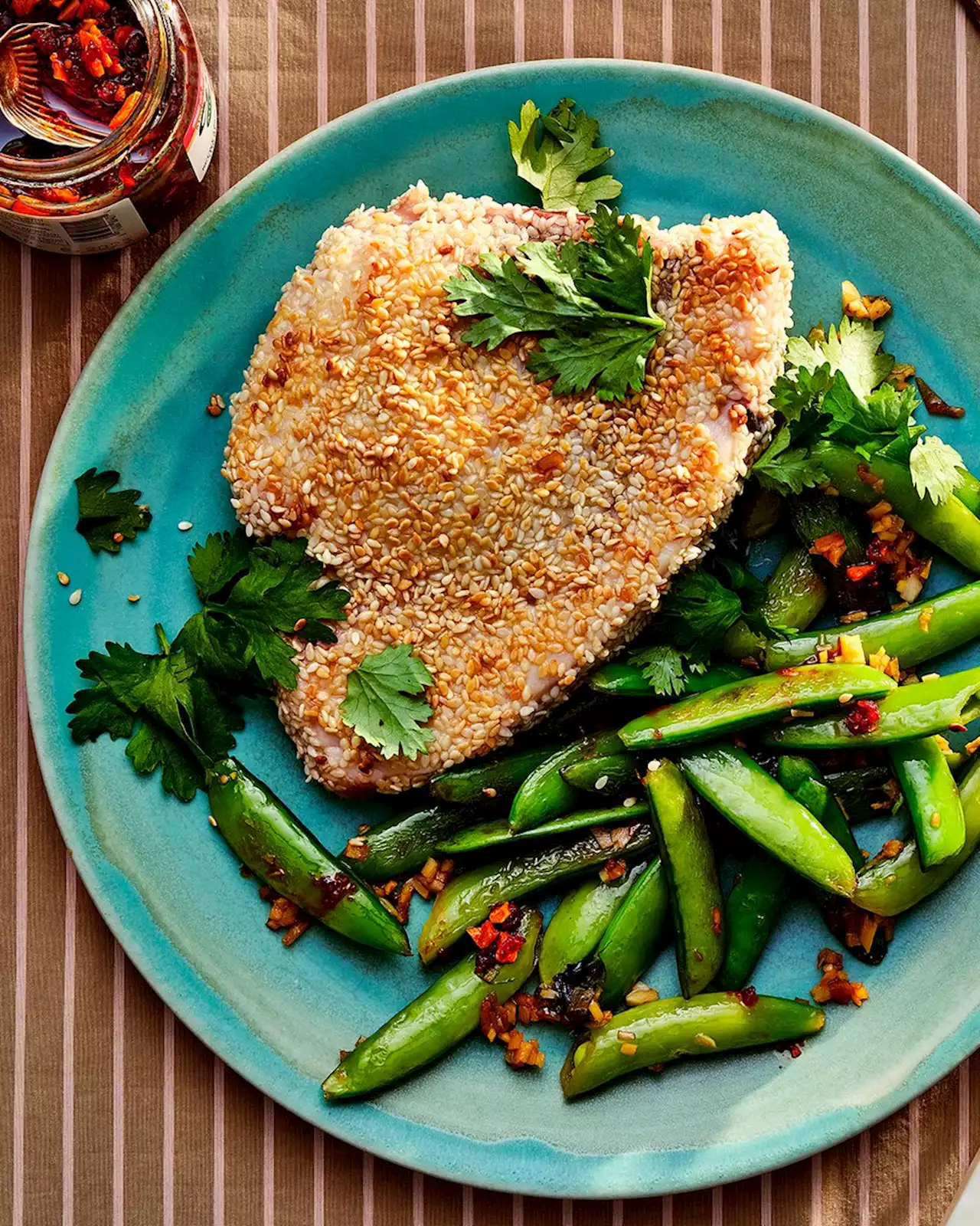 Pan-Seared Sesame Swordfish with Blistered Snap Peas and Chili Crisp