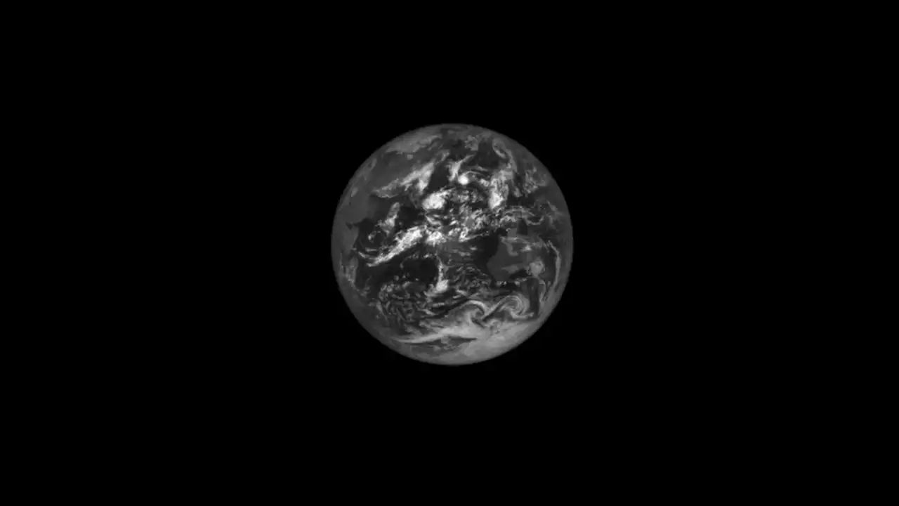 NASA's Asteroid Probe Captures Haunting Images of the Earth and Moon