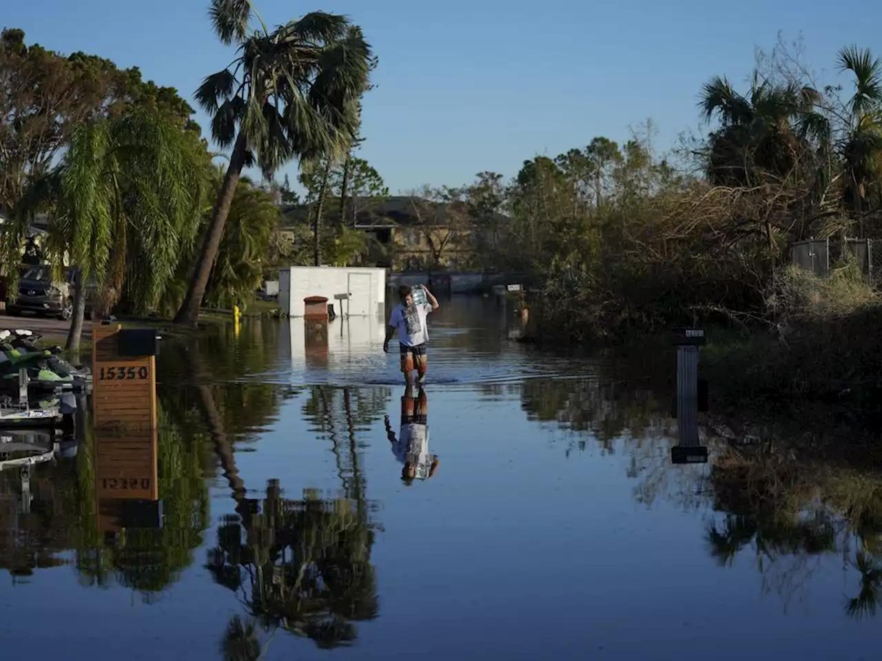 Poor Florida neighborhood battered by flood tries to recover