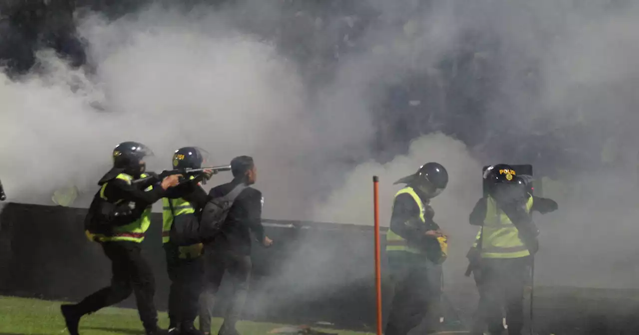 125 die as tear gas triggers crush at Indonesia soccer match