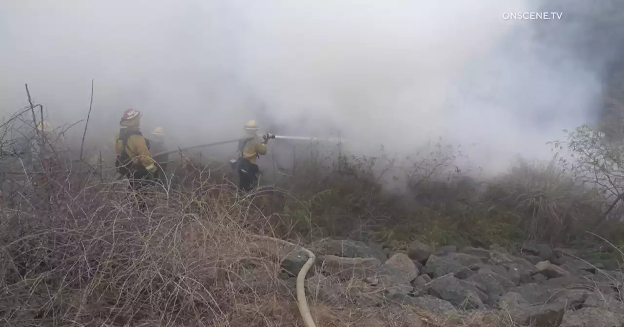 Crash sparks quarter-acre brush fire near Westfield Plaza Bonita mall