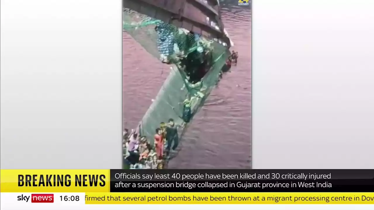 India bridge collapse: 60 people dead after hundreds plunge into river