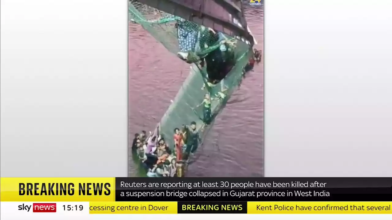 India bridge collapse: 60 people dead after more than 150 plunge into river