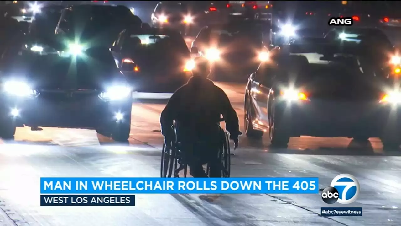 Man in wheelchair rolls down 405 Freeway in West LA area