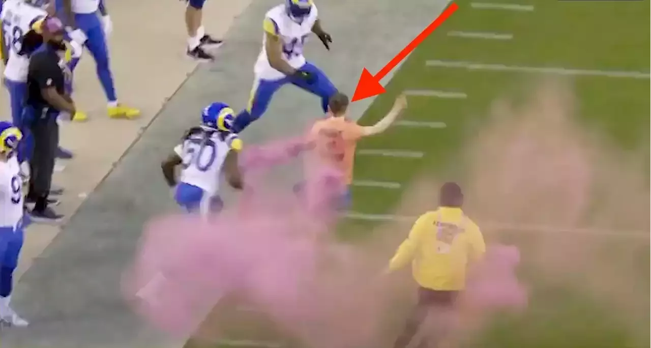 Bobby Wagner trucks protestor carrying pink flare during Rams-49ers game