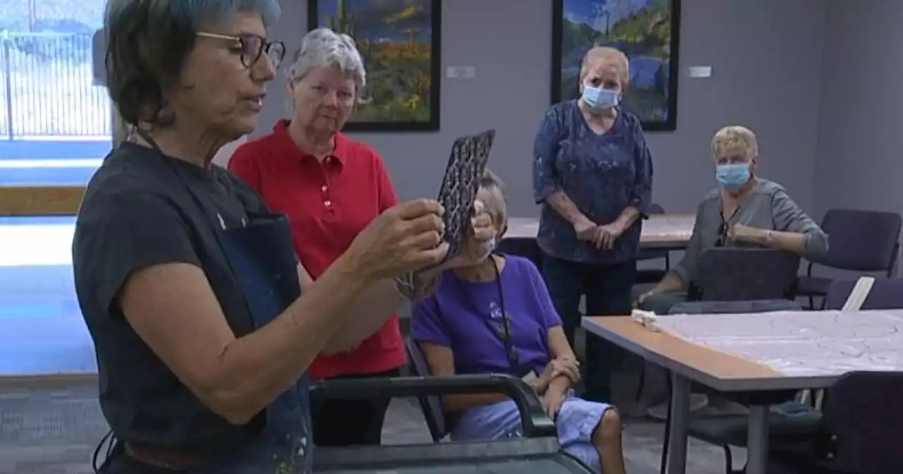 Seniors at TMC team up with a local artist to create a mural