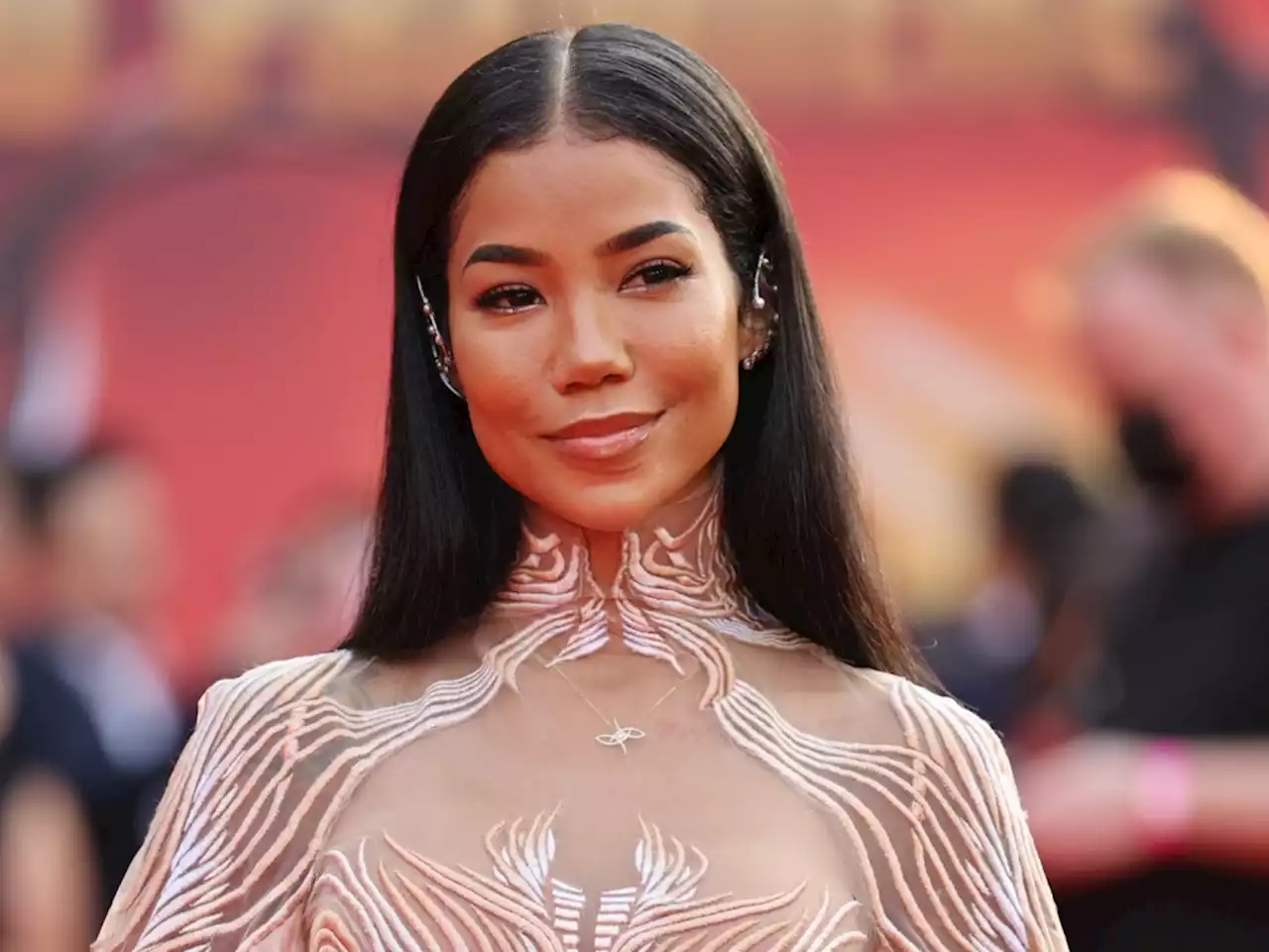 Jhené Aiko Proudly Shows Off Her Growing Baby Bump in a Series of Glamorous & Sheer Outfits