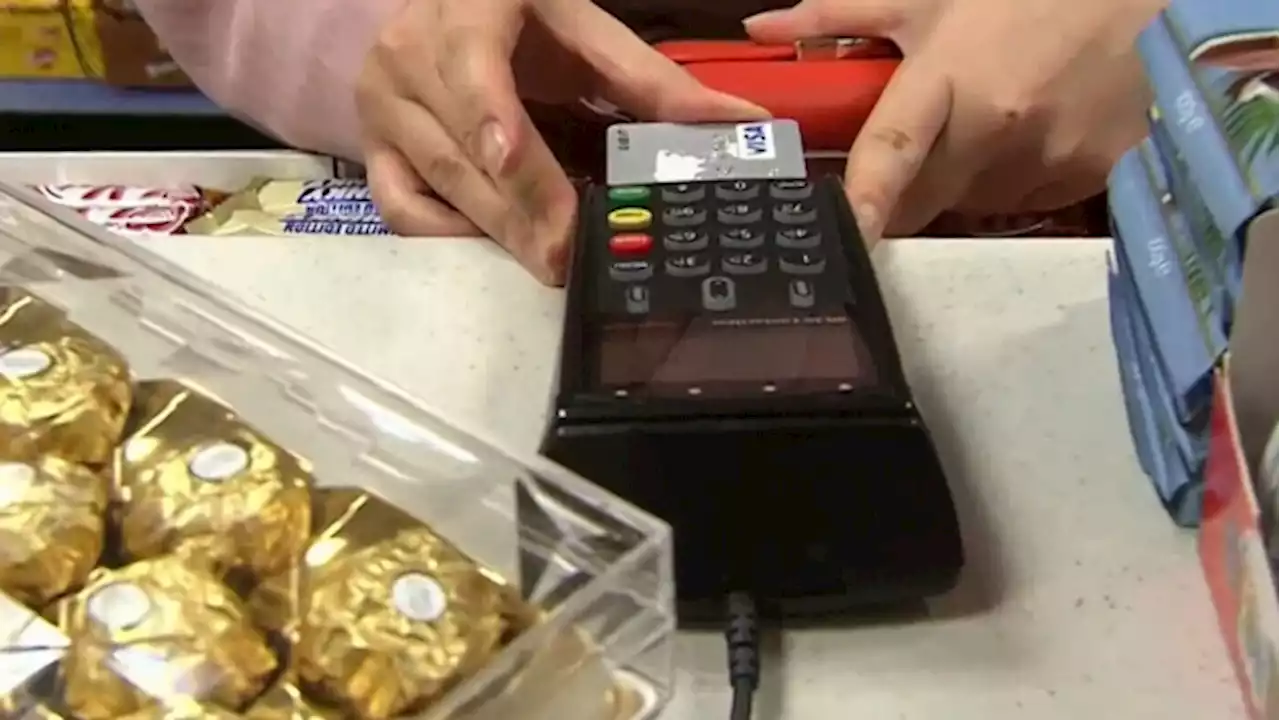 Here's why it may cost extra to use a credit card