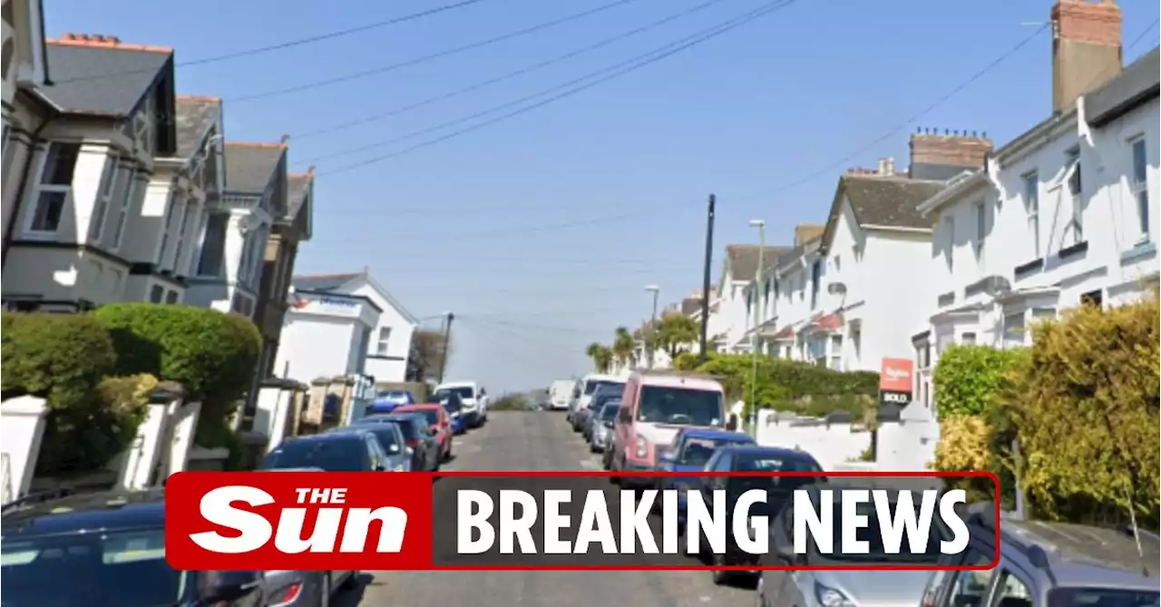 Boy, 15, rushed to hospital after stabbing on quiet street, as lad, 16, held