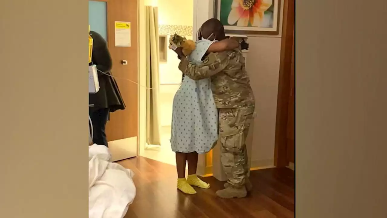 Husband returns from deployment early to surprise pregnant wife in hospital