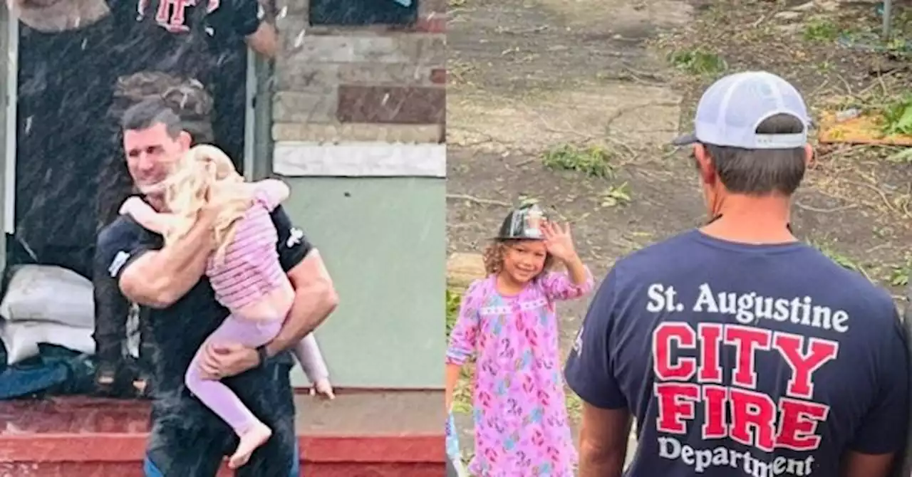 PHOTO: Firefighter Saves Child from Rising Waters During Hurricane Ian