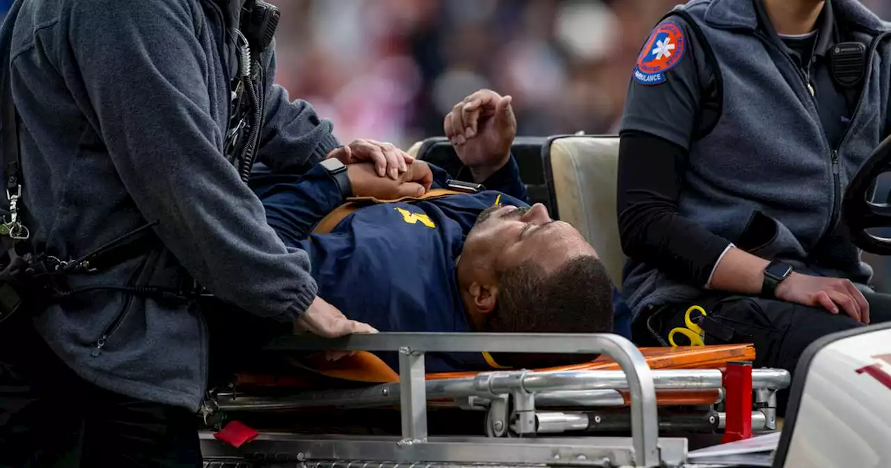 Michigan assistant coach Mike Hart hospitalized after collapsing on the sideline during a game against Indiana