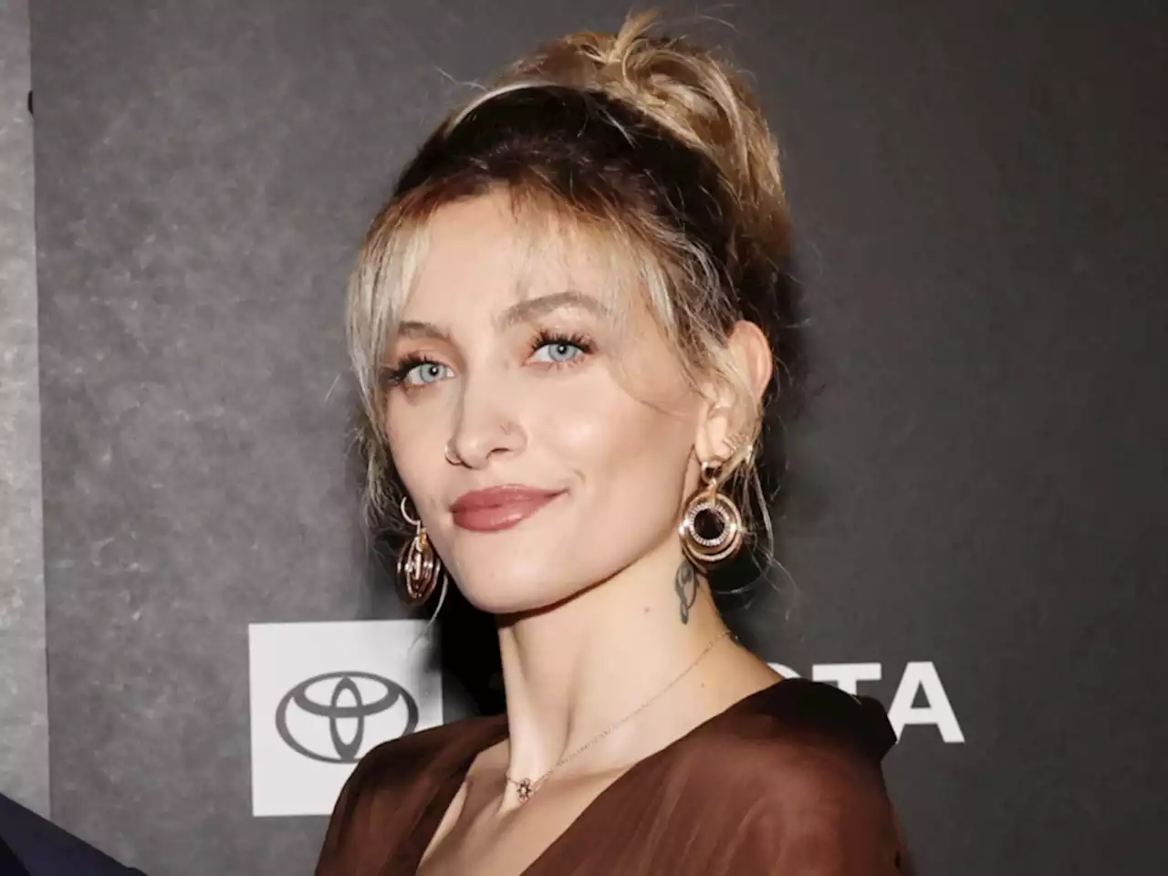 Paris Jackson Proves She’s a Fashion Chameleon in This Silk Brown Mini-Dress That Shows Off Her Long Legs