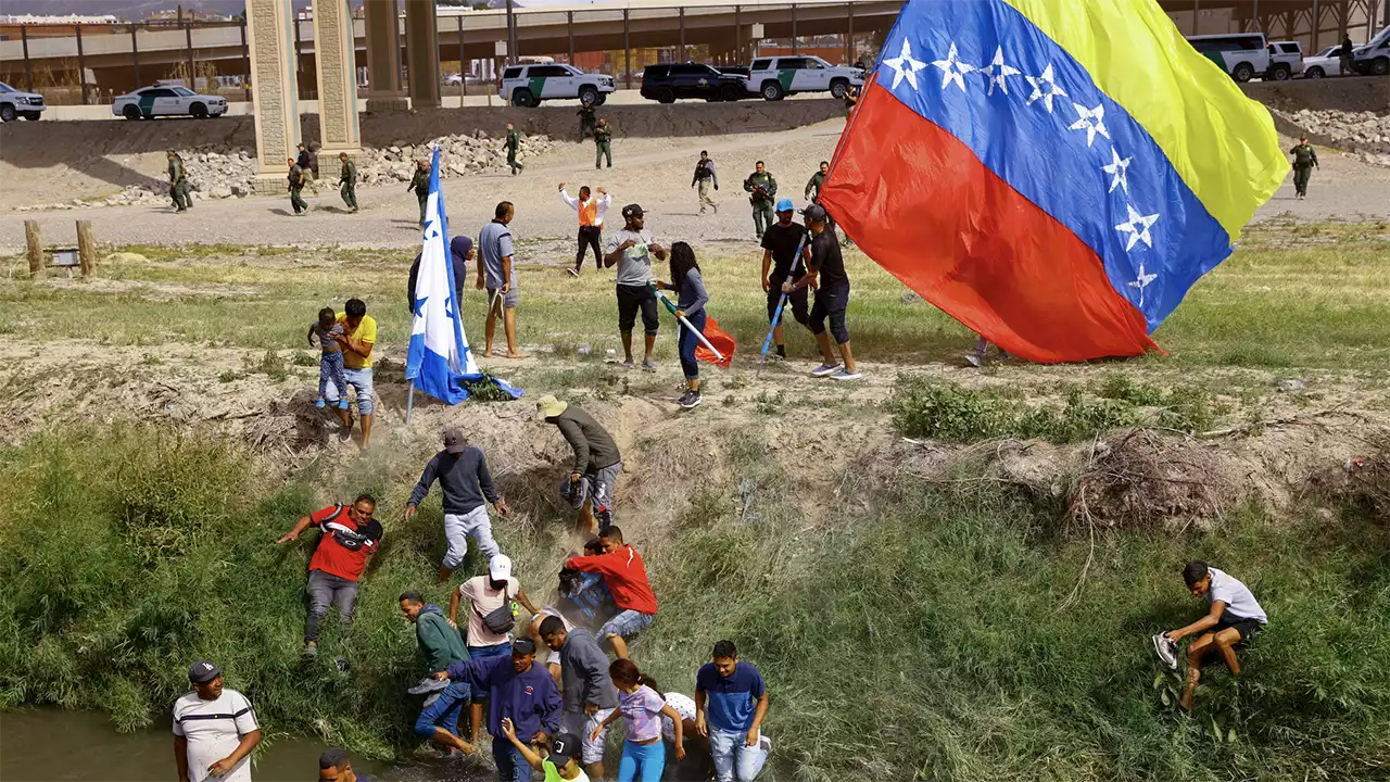 Border Patrol fires pepper balls at Venezuelan migrants after agent is assaulted with flag pole, officials say