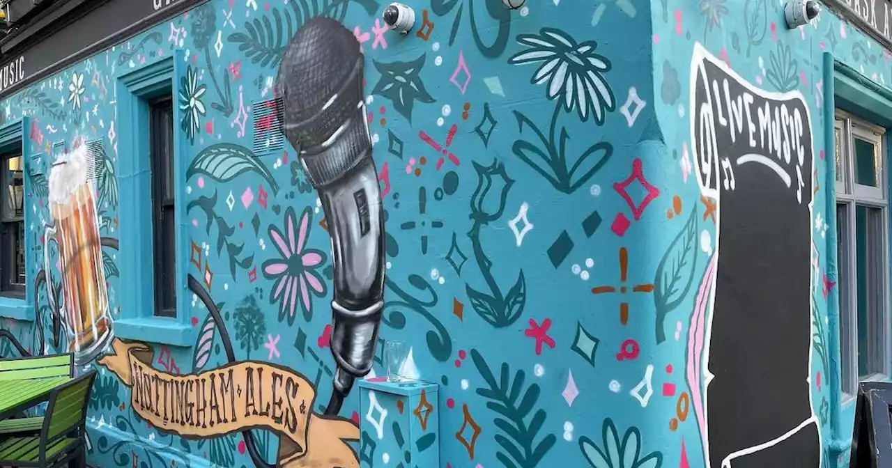 Controversy over pub's colourful artwork and giant microphone