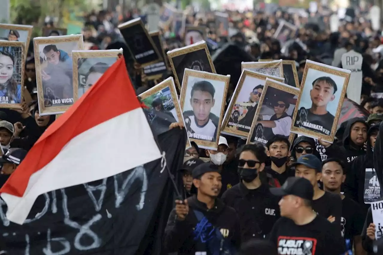 Indonesians march for justice after deadly soccer stampede