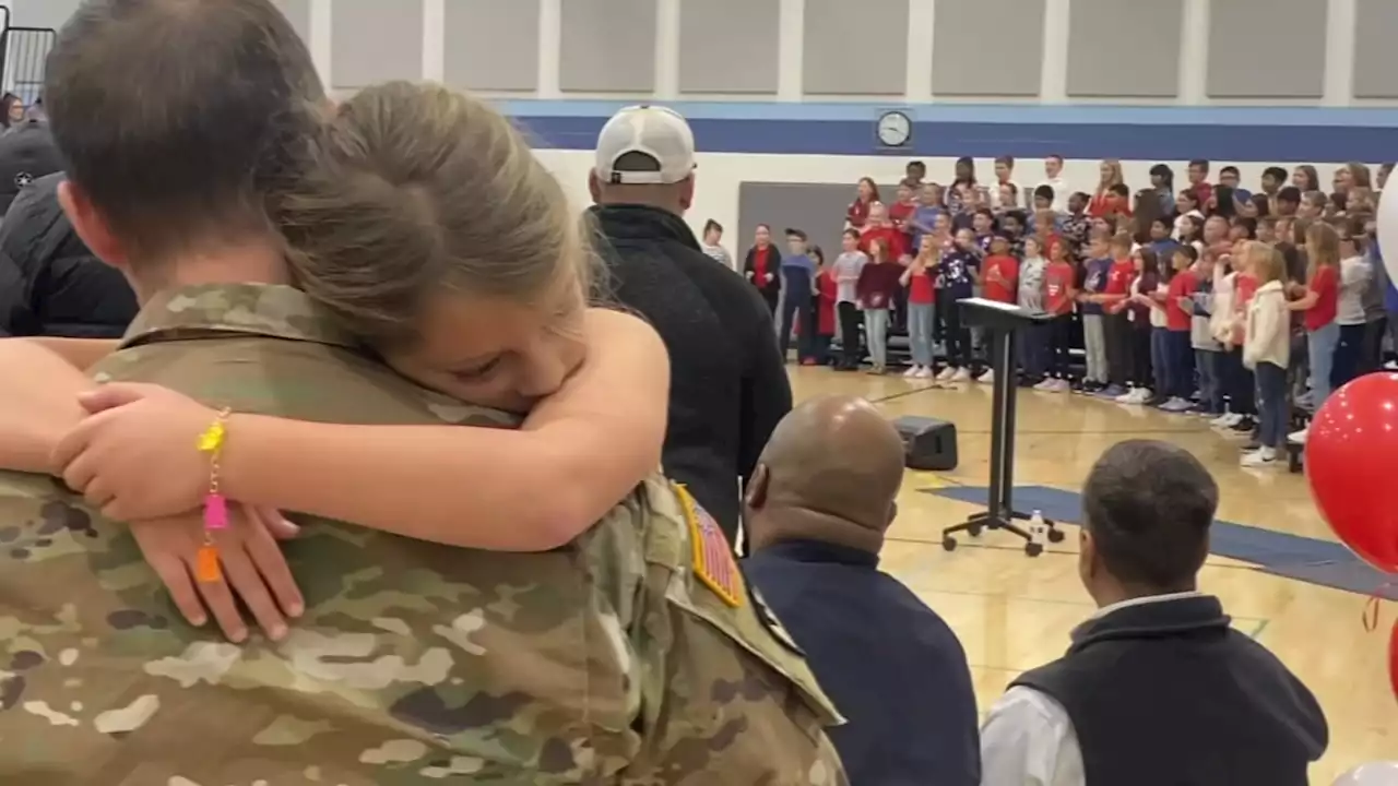 US Army soldier surprises daughter at Indiana elementary school's Veterans Day assembly