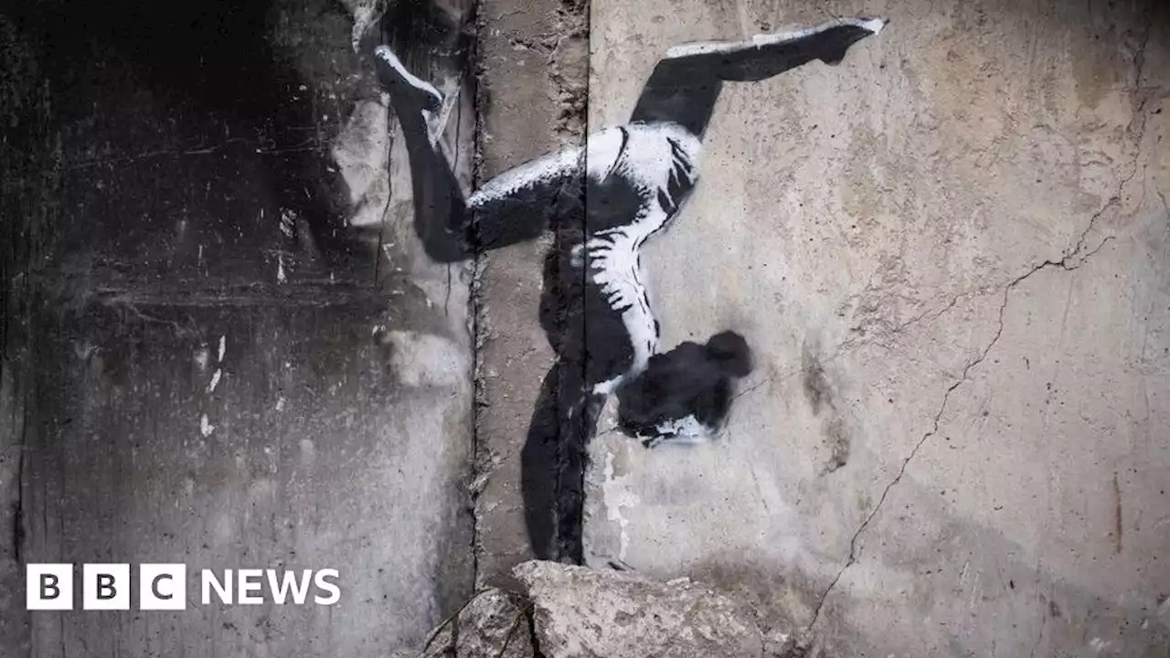 Banksy unveils Ukraine gymnast mural on building shelled by Russia