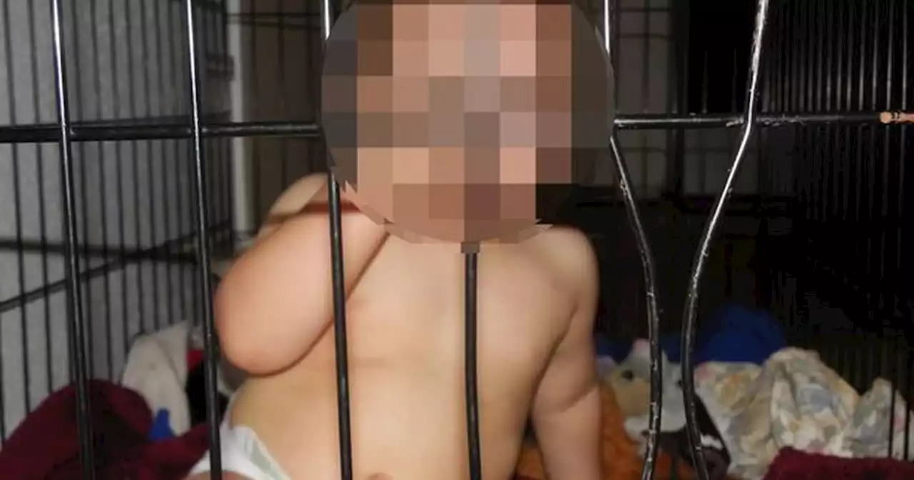 Boy, 9, forced to live in dog kennel by evil parents pictured in cage as baby