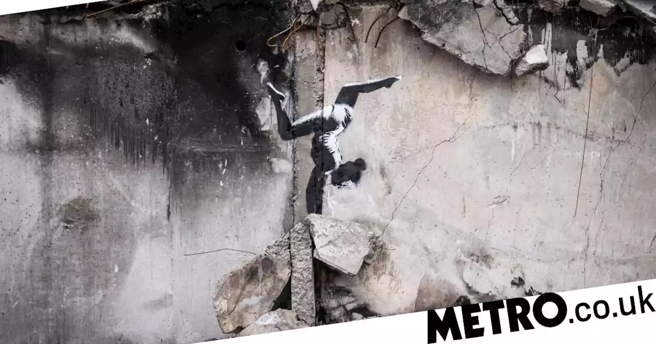 Banksy unveils new artwork on destroyed building in Ukraine