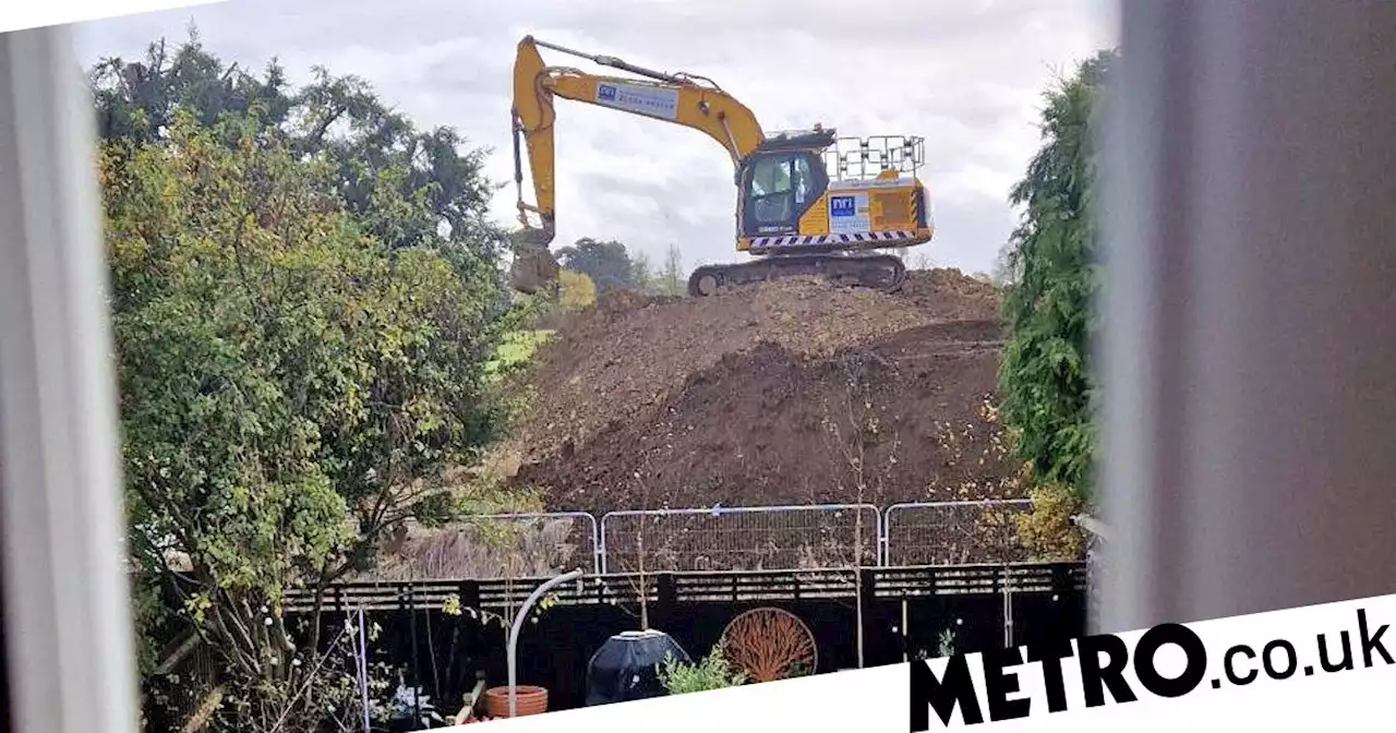 Family's lives 'a living hell' over 30ft 'mud mountain' dumped at end of garden