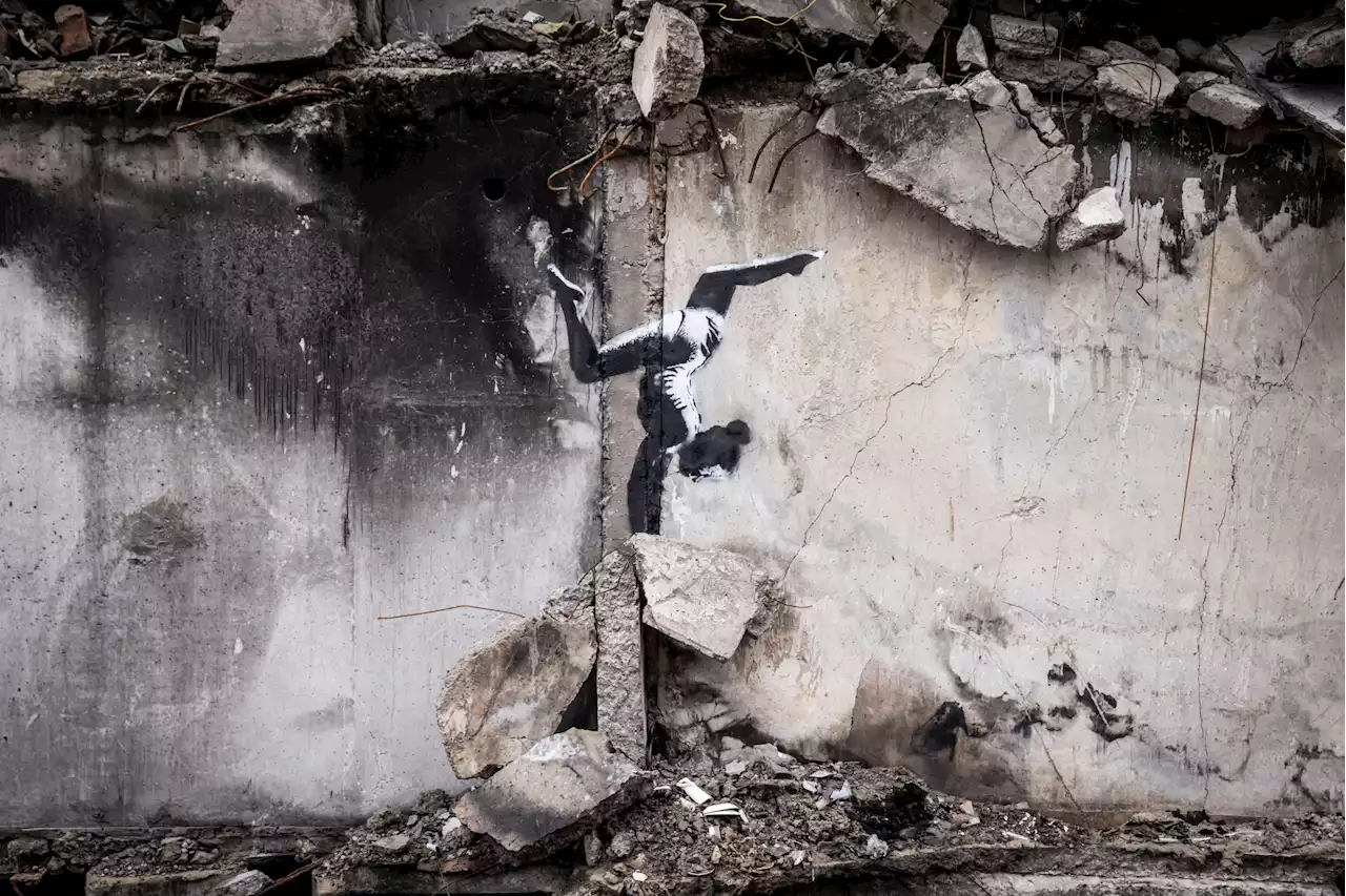 Banksy reveals new image of a gymnast balancing on rubble in a war-torn town in Ukraine