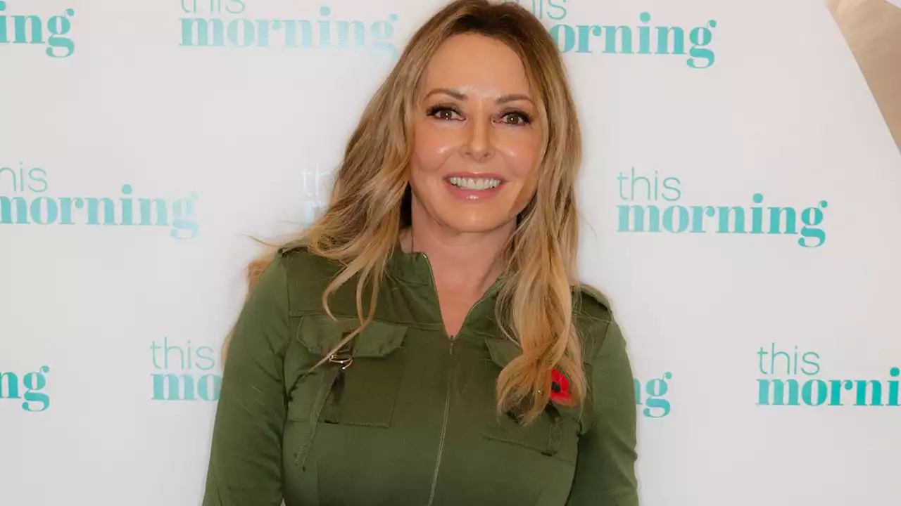 Carol Vorderman looks incredible as she shows off curves in tight green jumper