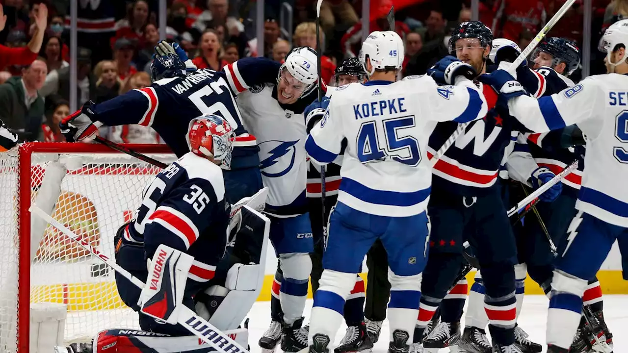 Fight breaks out during video review of shot to the head during Lightning-Capitals game