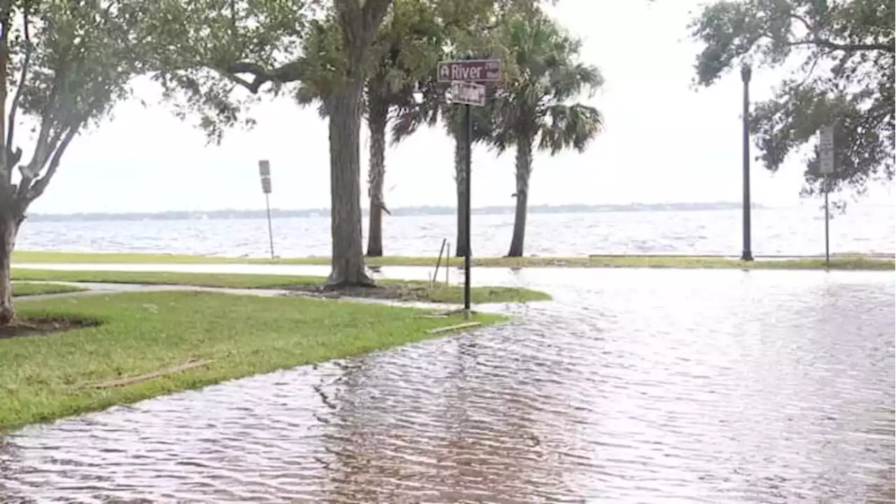 People living and working in Jacksonville clean-up and assess flood damage after Nicole