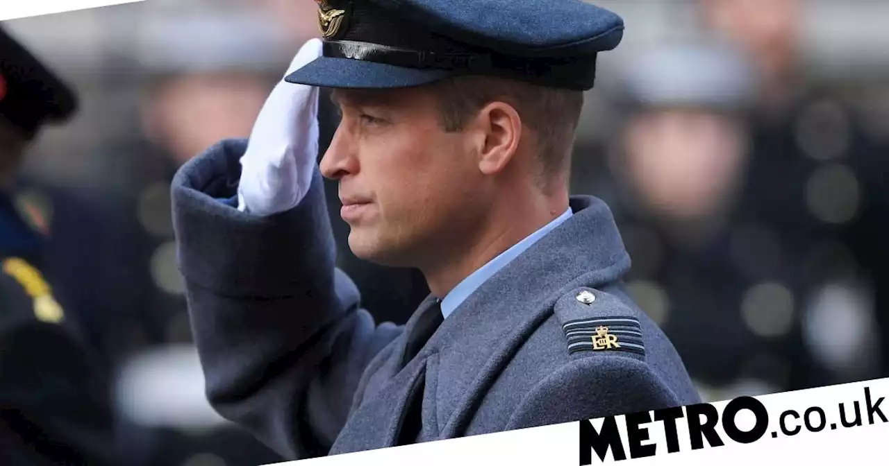 William lays his first poppy wreath as Prince of Wales as Kate watches