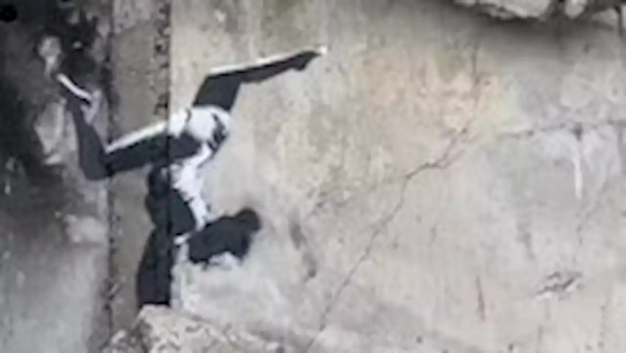 Banksy unveils mural of gymnast on a destroyed building in Ukraine