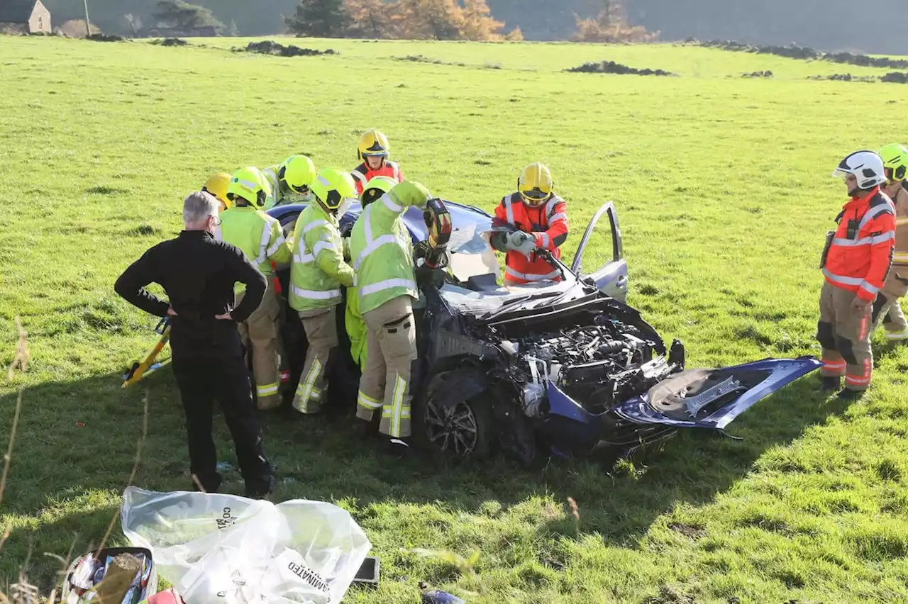 Pictures show wreckage of car which smashed into stone wall and came to rest in a field