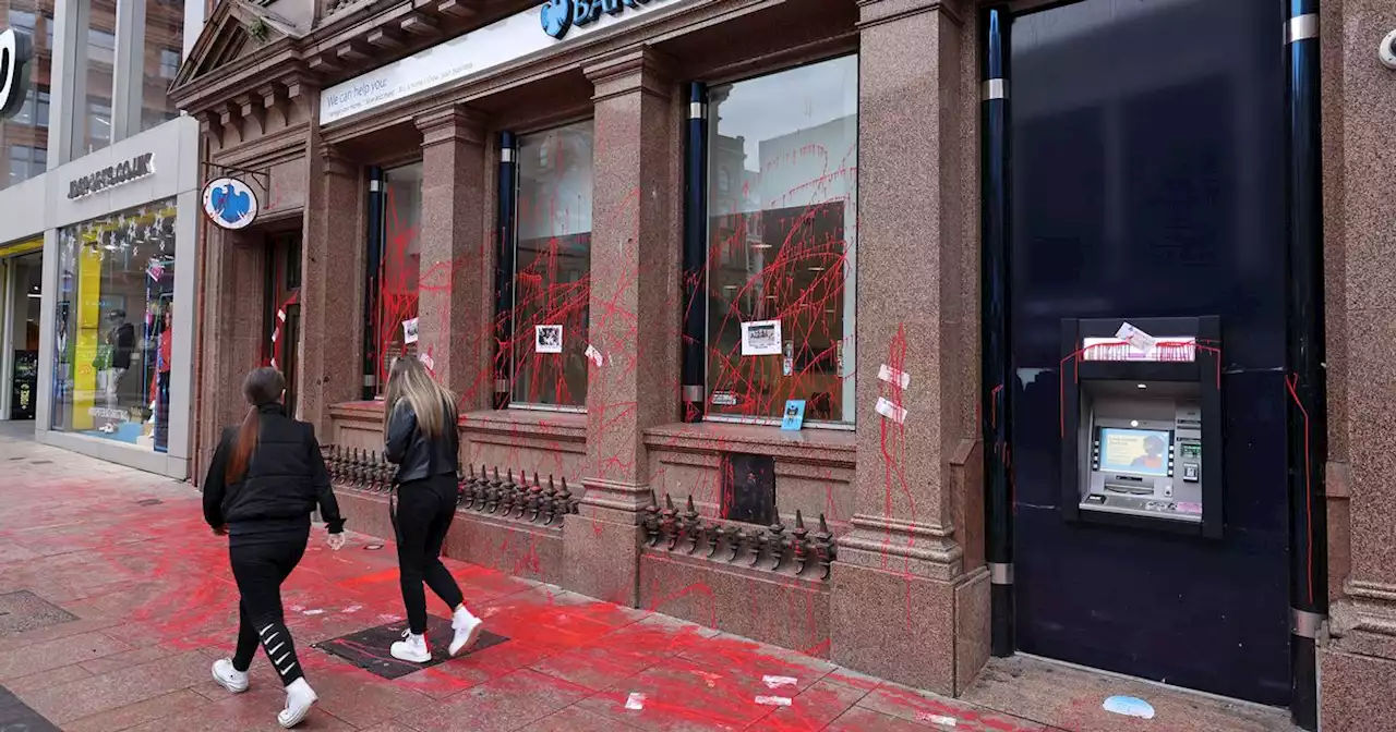 Arrests after activists spray paint on Belfast bank during protest