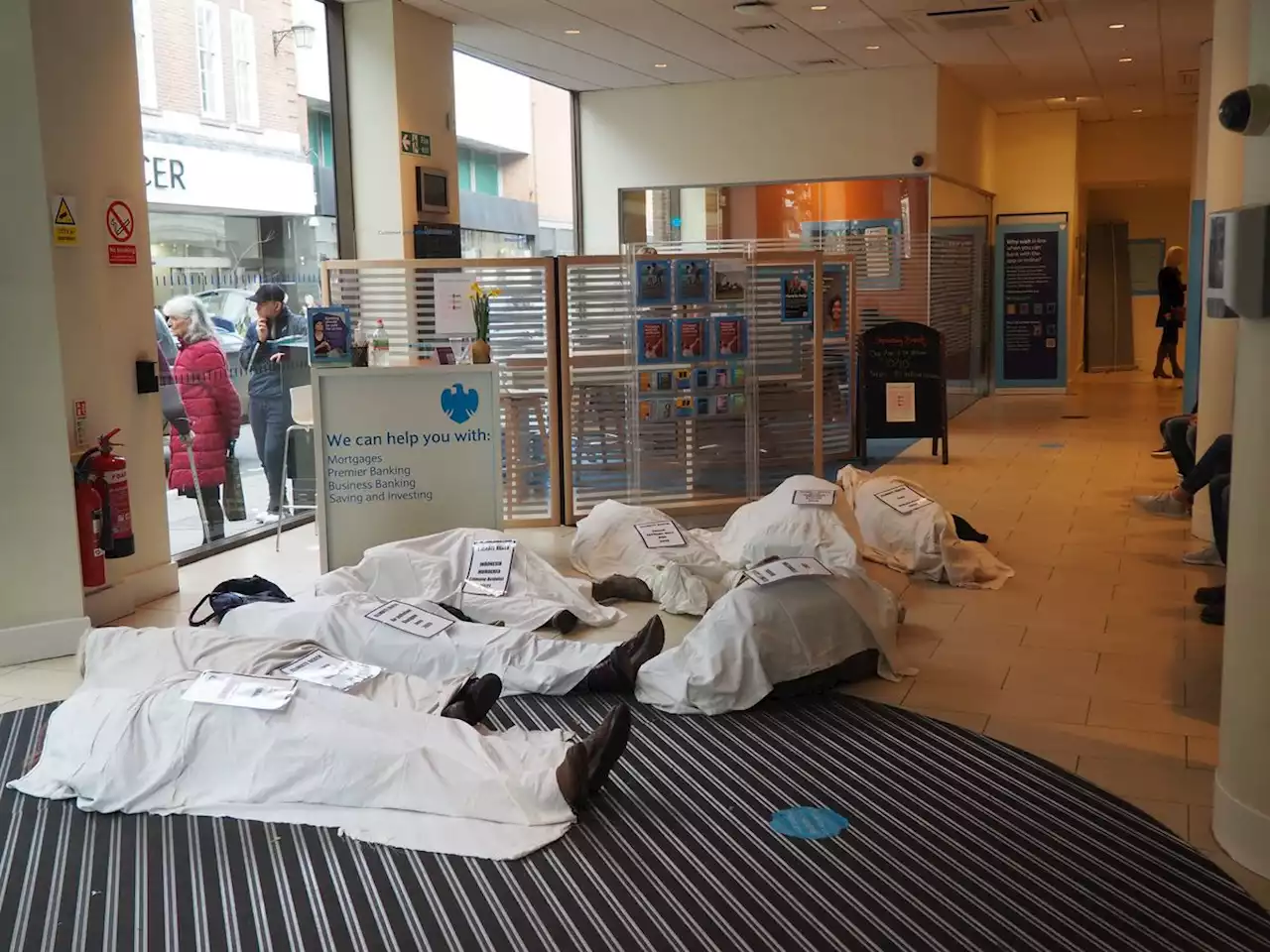 Extinction Rebellion campaigners hold 'corpse' protest inside Shrewsbury bank