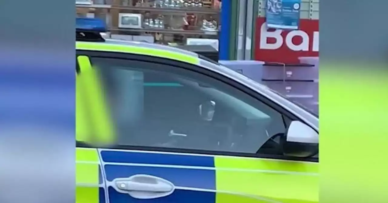 Public fuming after police officer 'spotted on phone behind the wheel'