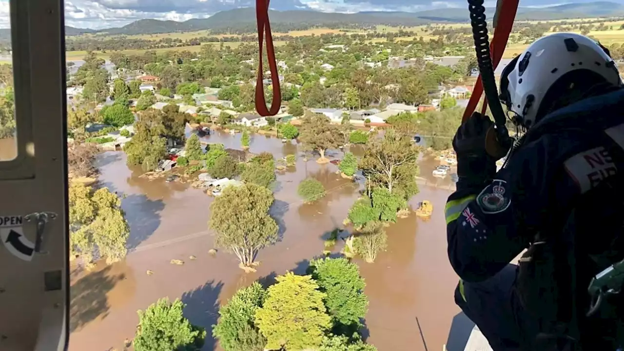 Hundreds rescued by helicopters and boats after heavy rainfall sparks floods in Australia