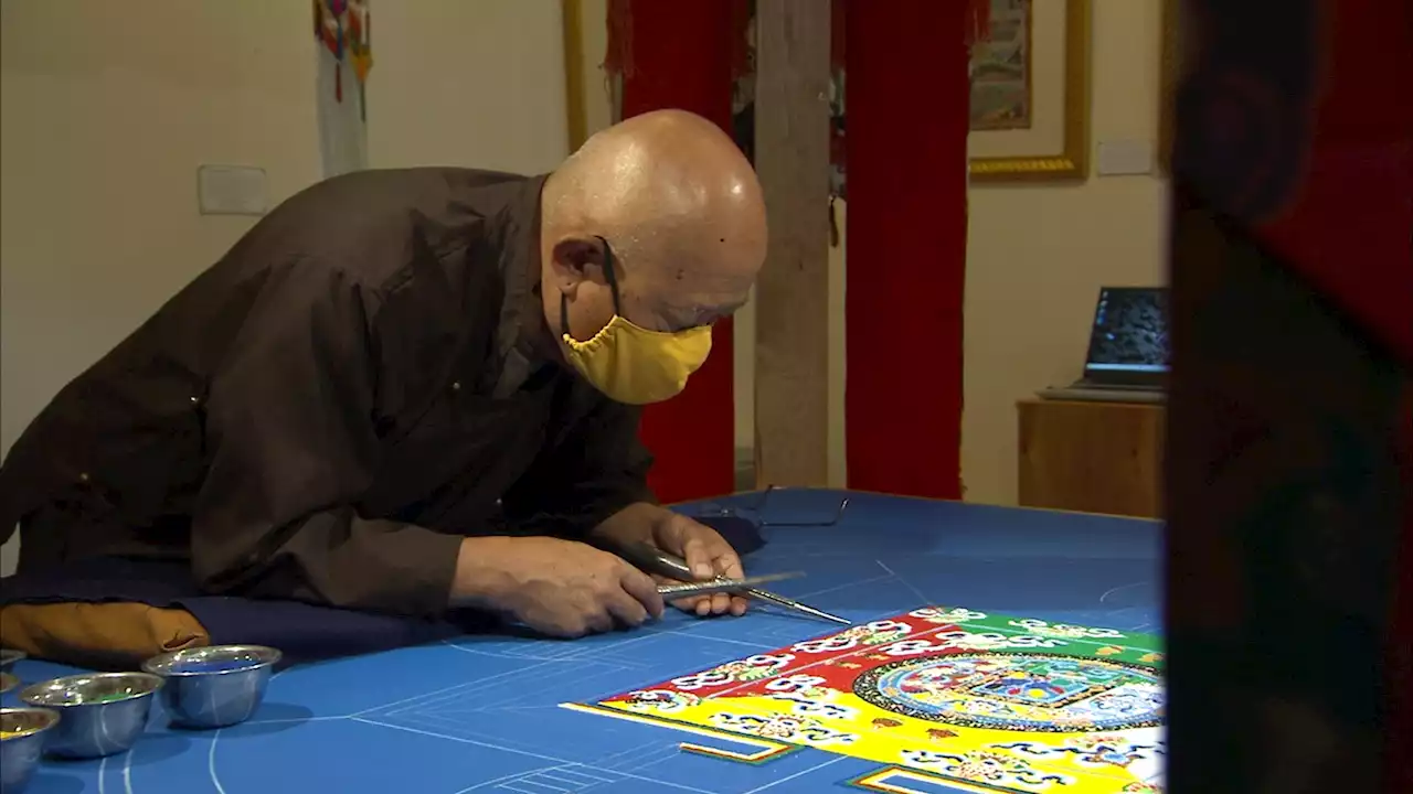 Mandala Master praying ancient art will bring peace to Philadelphia