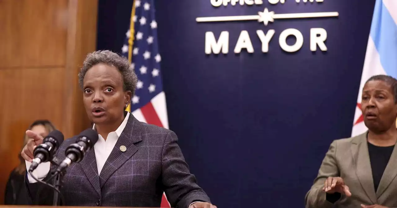 Mayor Lori Lightfoot chastises security detail for parking in a bike lane while she picked up doughnuts