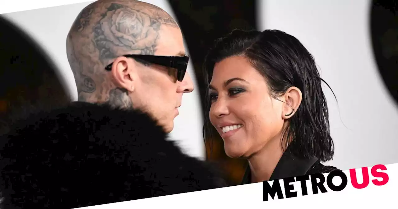 Kourtney Kardashian sinks teeth into Travis Barker's face at GQ Men of the Year