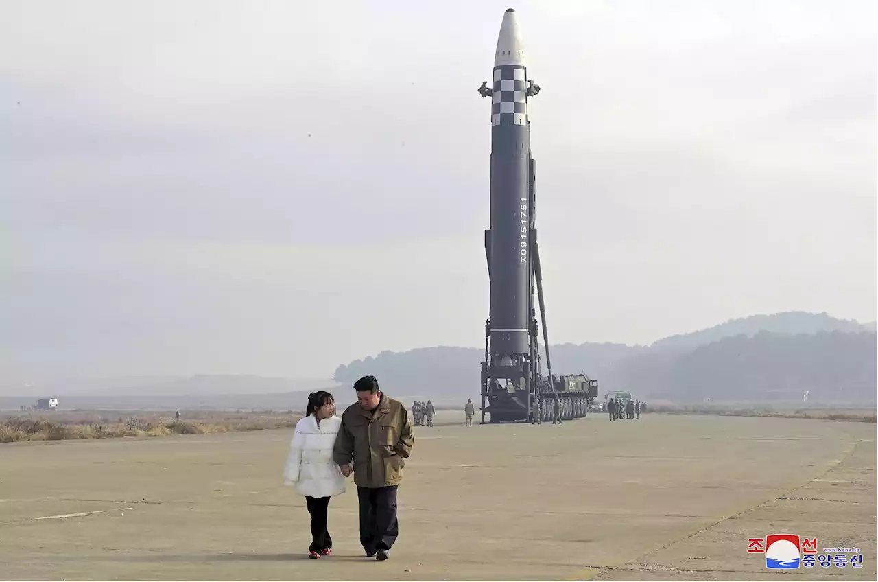 North Korea unveils Kim's daughter at missile launch site