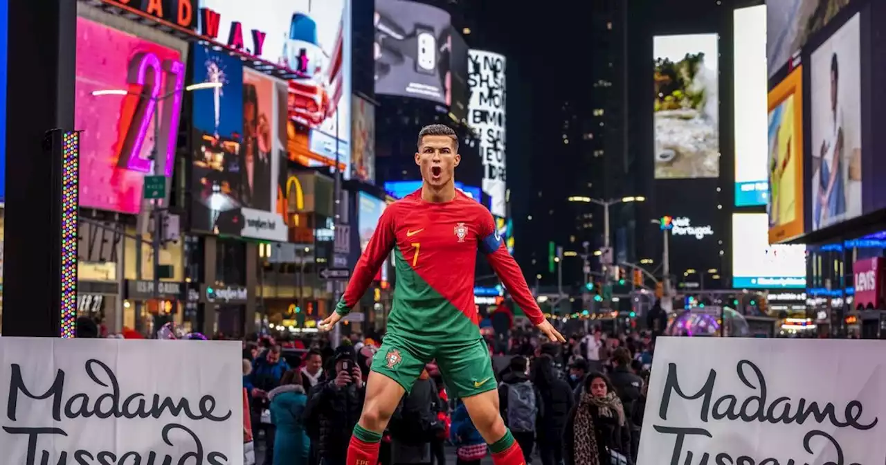 Manchester United's Cristiano Ronaldo greets waxwork figure in Times Square