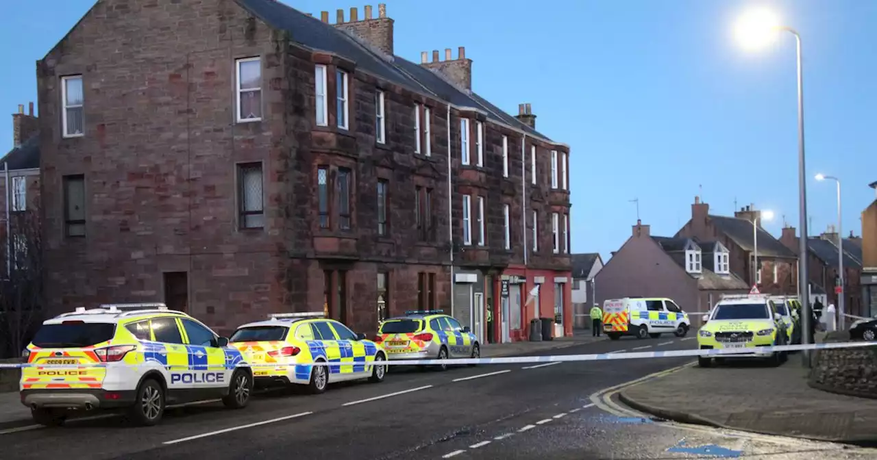 Armed cops seal off street in Scots town as officers deal with ongoing incident