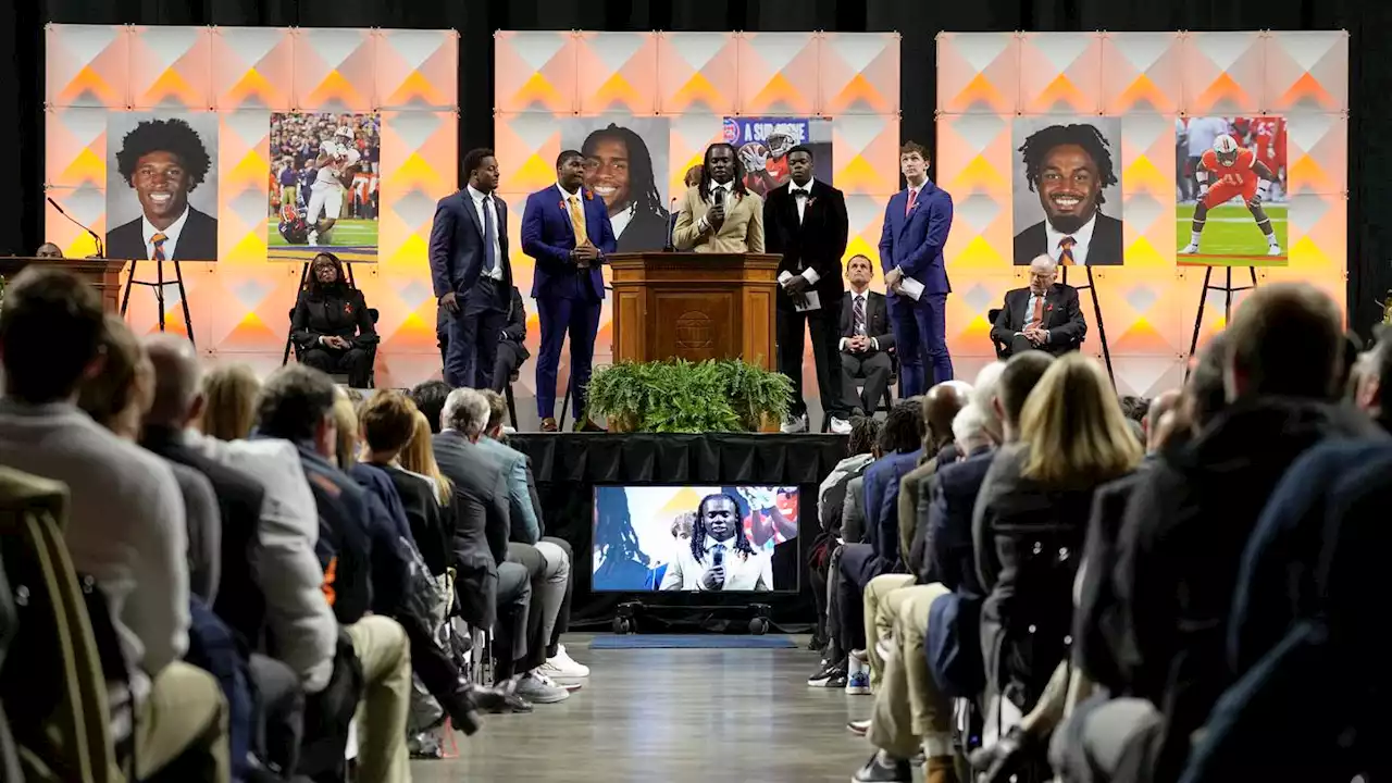 Virginia honors slain players in memorial service on campus