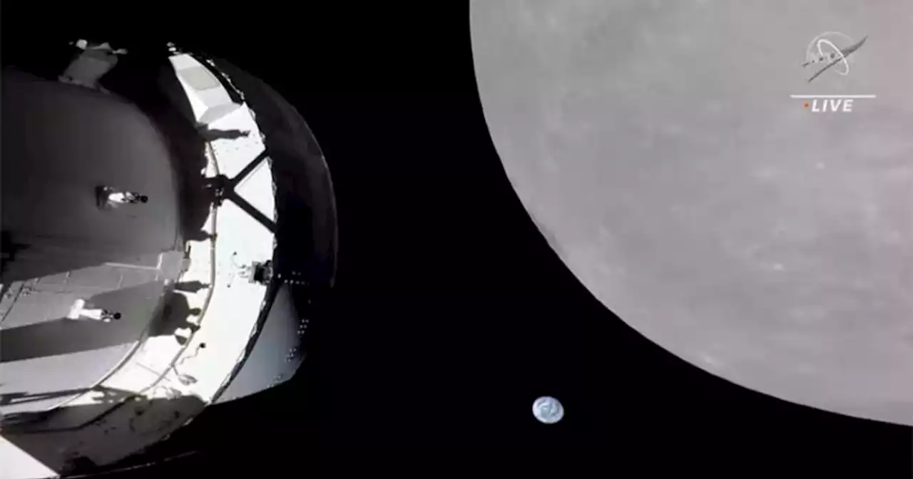 NASA's Orion capsule races past the moon in a course-changing flyby