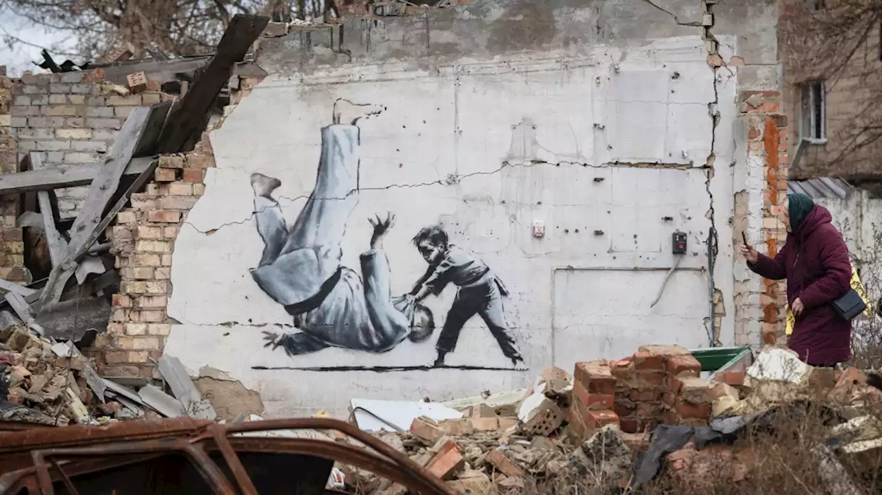 In cold Ukraine village, Banksy mural offers warm bath