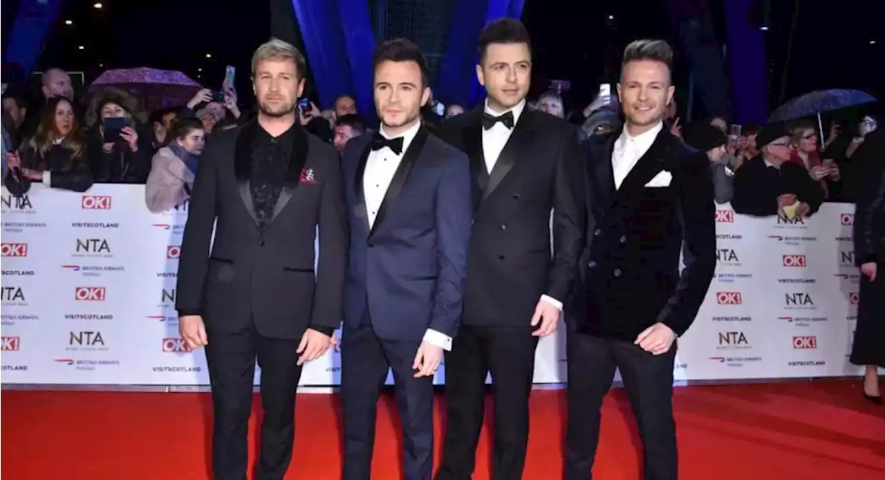 'Chatted away': Westlife stars pose for pictures during stay at Glasgow hotel