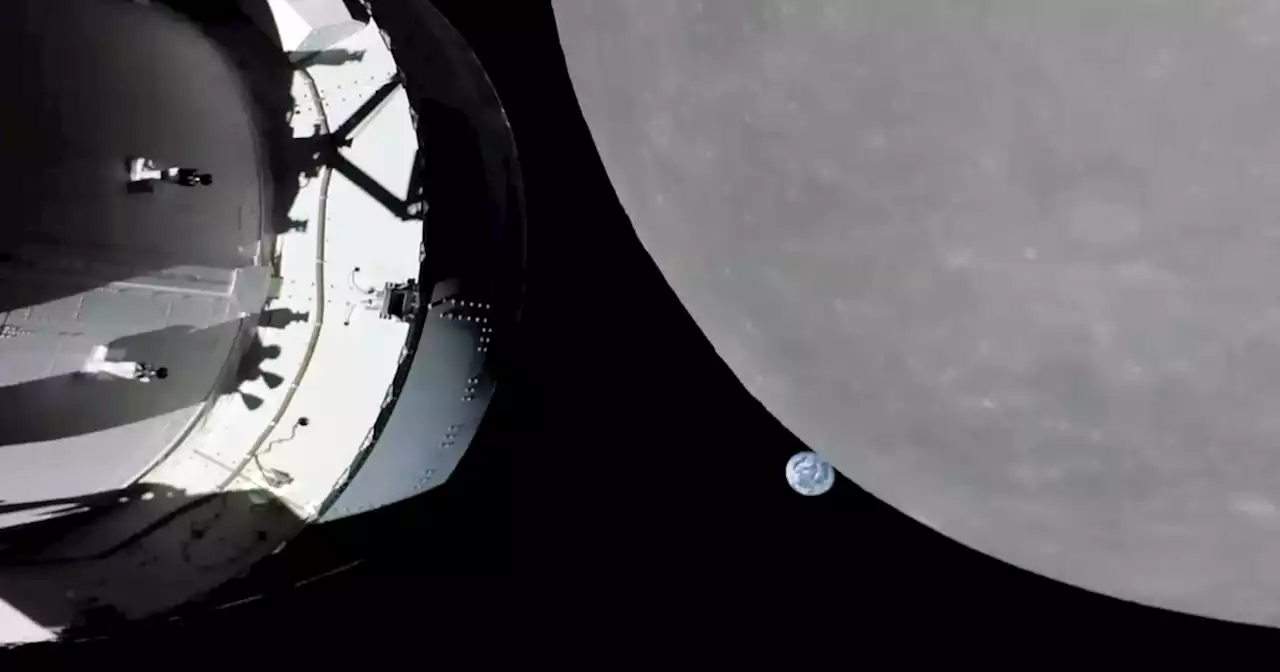 NASA capsule buzzes moon, last big step before lunar orbit