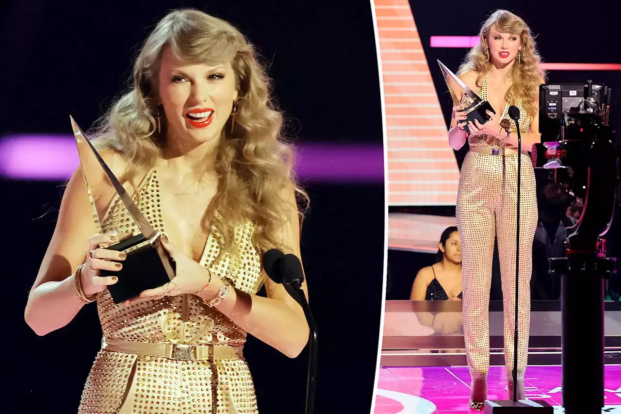 Taylor Swift goes glam in plunging jumpsuit at AMAs 2022