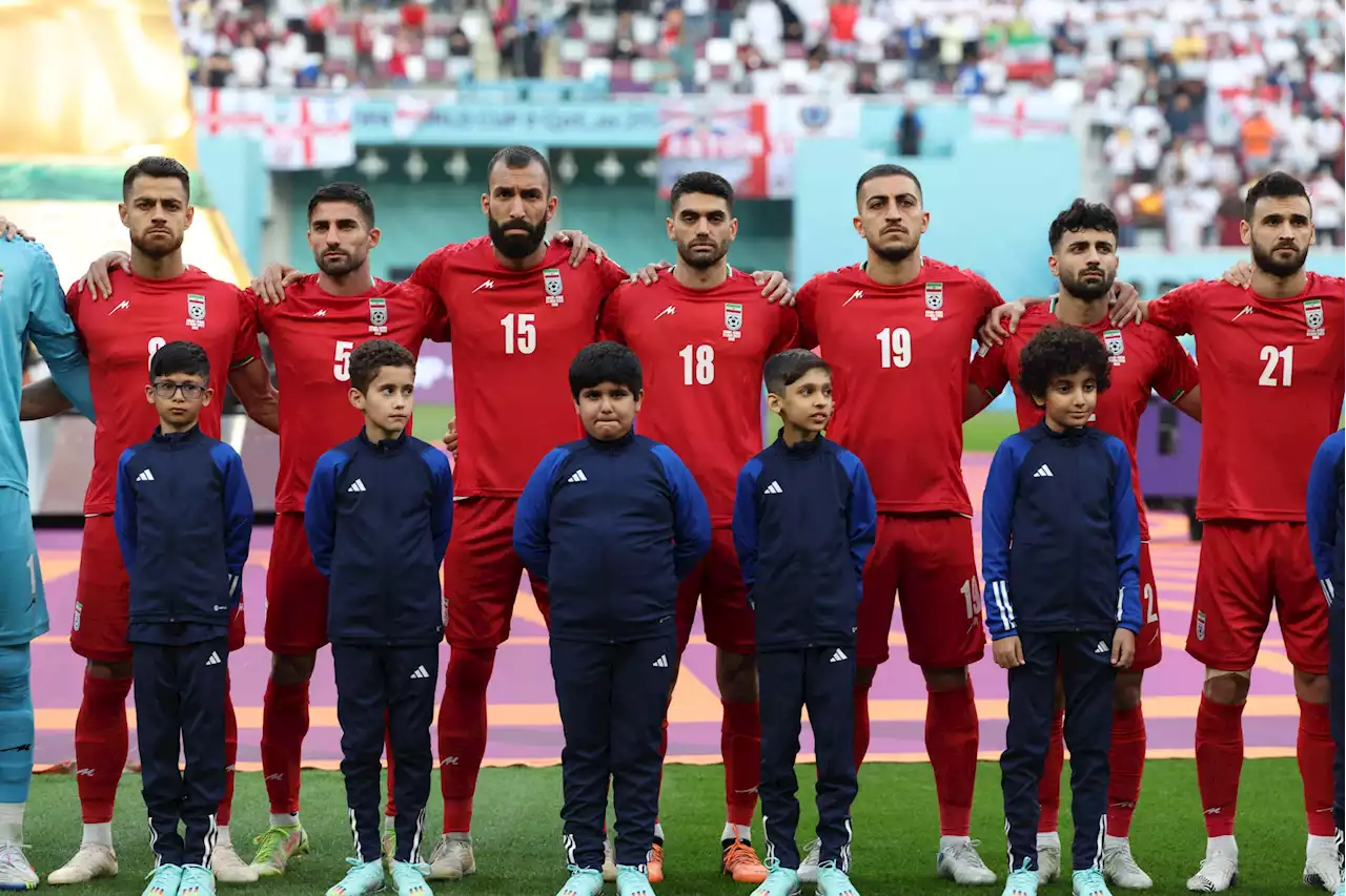 Powerful moment Iran World Cup team refuse to sing their national anthem amid protests at home